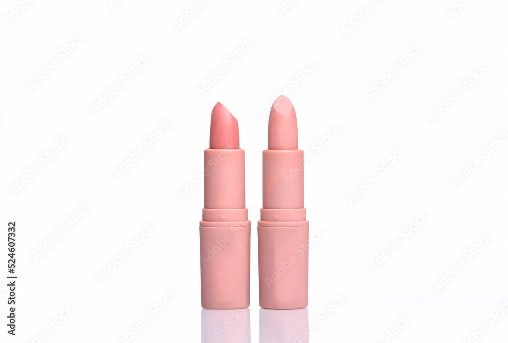 Two Pink lipstick tubes isolated on white background