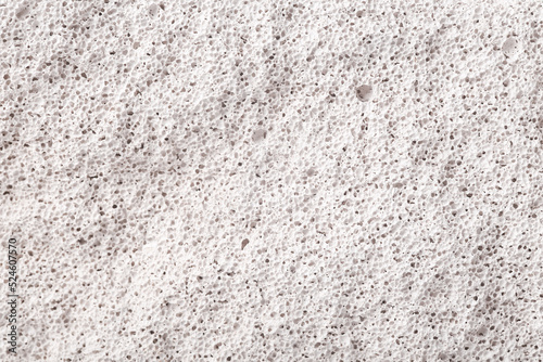 Texture of white porous stone closeup. photo
