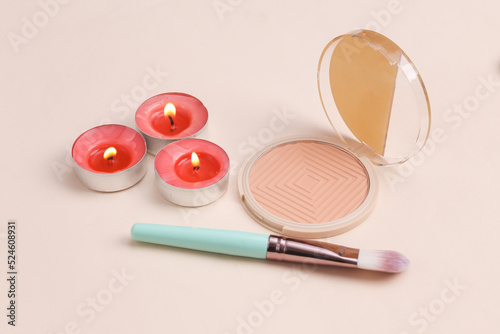 Spa salon, beauty concept. Powder box with aroma candles on a beige background