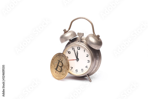 Bitcoin with alarm clock isolated on white background