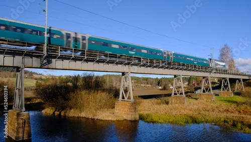 Bergen to Oslo train crossing river near Honefoss, Norway