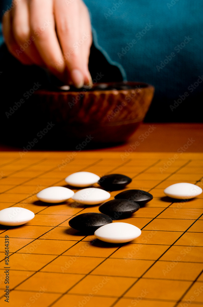 playing a move on the goban during a GO game playing a move on the goban during a GO game