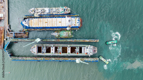 Photography cargo container ship at dry dock concept maintenance service working in the sea