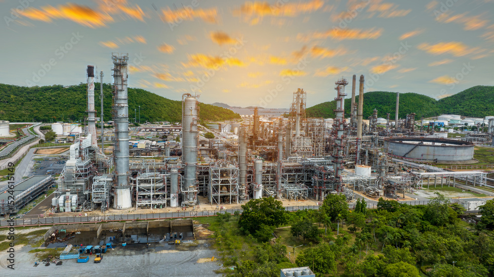 Fototapeta premium Oil Refinery Gas Chemical Equipment Prodiction import export Concept, Crude Oil Refinery Plant Steel Pump Pipe line and Tank and Cooling tower, Chemical or Petrochemical Factory plant, industry