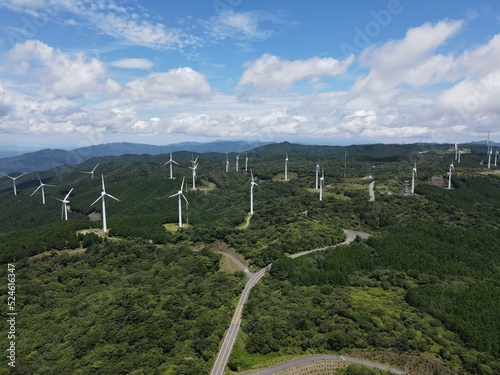 青空の青山高原の風車群をドローンで空撮した写真