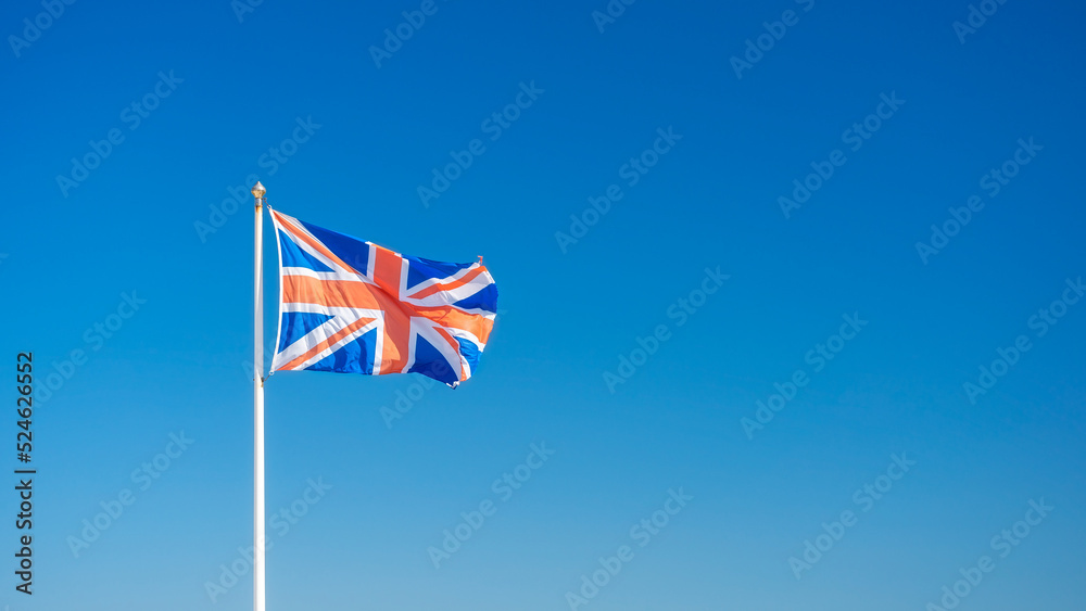 Flag of United Kingdom isolated on clear bottom of sky.