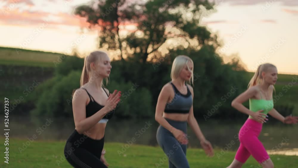 fitness models ladies are jumping outdoors, medium portrait of beautiful blonde women, attractive sportswomen fitness models ladies are jumping outdoors, medium portrait of beautiful blonde women, attractive sportswomen