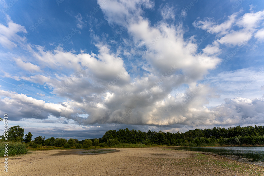 Fototapeta premium Storm clouds with rain, severe weather and dramatic clouds nature background Germany Bavaria. climate change with storms.