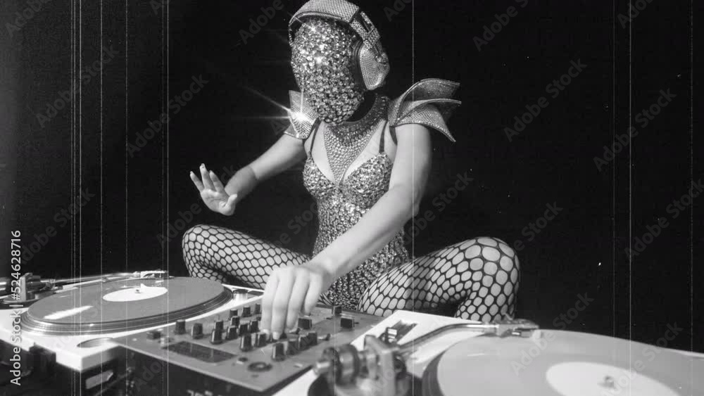 Masked female dj with turntables