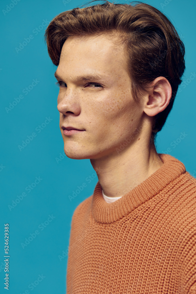 close portrait of a funny guy with freckles squinting his eyes close portrait of a funny guy with freckles squinting his eyes