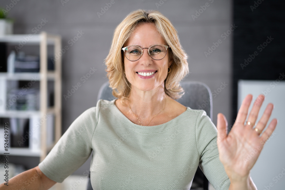 Fototapeta premium Portrait Of Happy Young Woman Waving