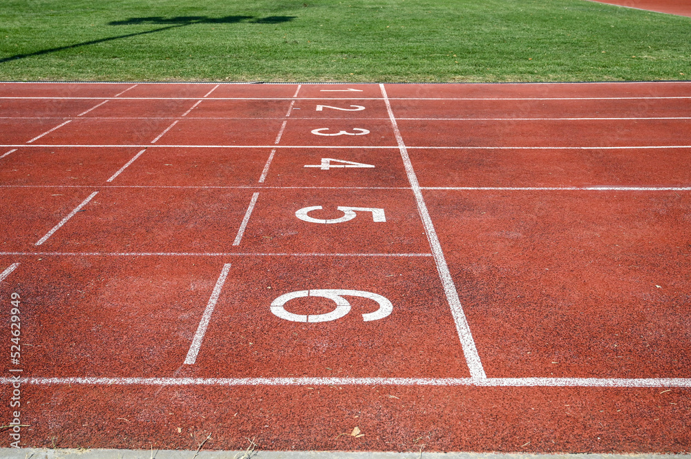 Running track numbers. Red running track with lanes and numbers. Starting positions for running at stadium. Running track numbers. Red running track with lanes and numbers. Starting positions for running at stadium.