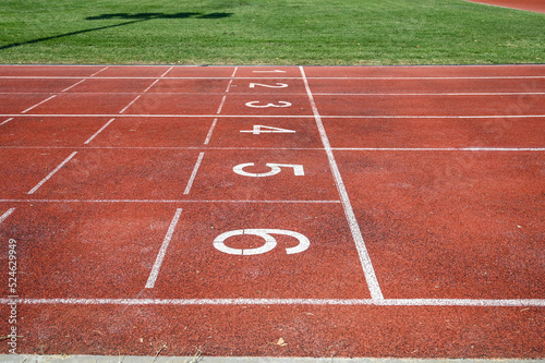 Running track numbers. Red running track with lanes and numbers. Starting positions for running at stadium.