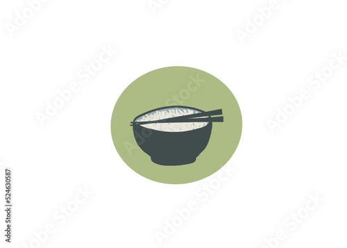 Bol de riz asiatique avec baguettes sur fond vert