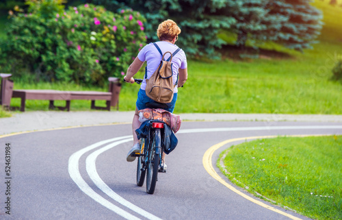 Cyclist ride on the bike path in the city Park 