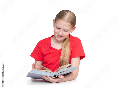 Happy smiling girl in a red T-shirt enthusiastically reading a book, isolated on a transparent background