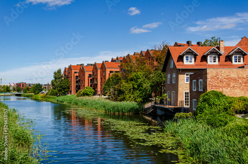 Modern houses by river in Gdansk.