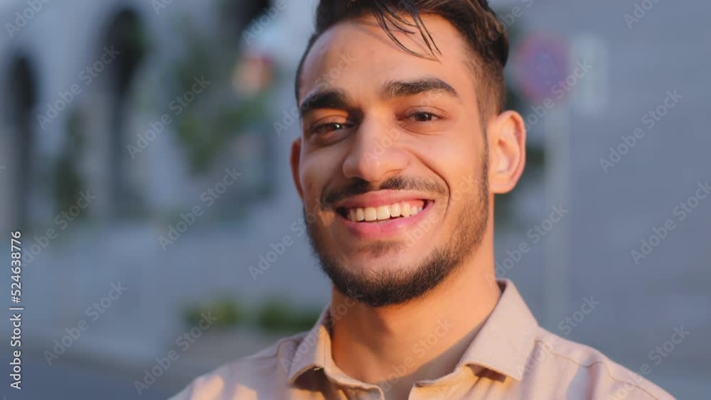Close up head shot portrait in city outdoors Hispanic Arabian Latin Indian bearded businessman happy guy satisfied cheerful carefree man CEO boss leader smiling toothy looking at camera face in city Close up head shot portrait in city outdoors Hispanic Arabian Latin Indian bearded businessman happy guy satisfied cheerful carefree man CEO boss leader smiling toothy looking at camera face in city