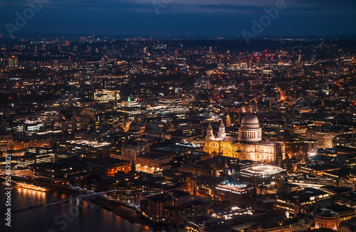 Aerial view of north east part of London, in evening. St Pauls Cathedral visible over river Thames © Lubo Ivanko