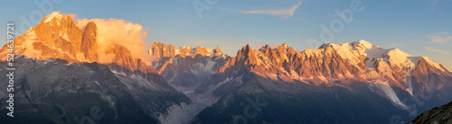 The panorama of Mont Blanc massif  Les Aiguilles towers, Grand Jorasses and Aiguille du Verte in the sunset light. © Renáta Sedmáková