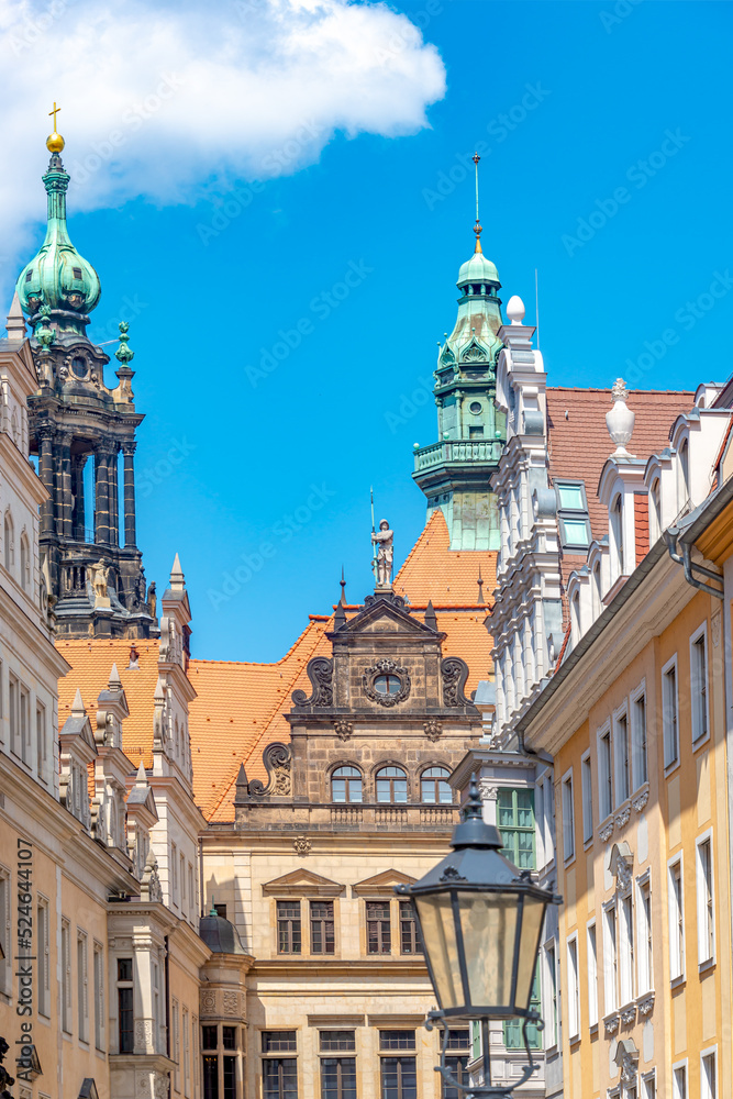 Cityscape of beautiful old Dresden. Historical, touristic and shopping center in downtown of Dresden, illuminated street, Germany, at sunny day.