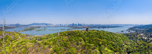 Fototapeta Naklejka Na Ścianę i Meble -  Aerial photography of Yuantouzhu scenic spot with cherry blossoms blooming in Wuxi City, Jiangsu Province, China in spring