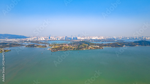 Aerial photography of Bogong Island Ecological Park, Yuantouzhu Scenic Area and the city center building complex in Wuxi City, Jiangsu Province, China