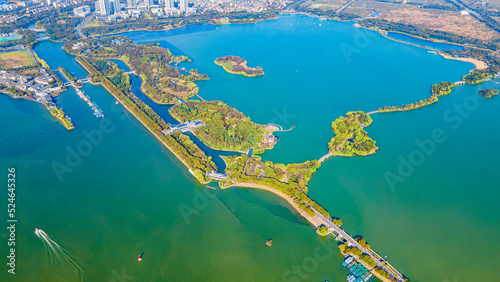 Aerial photography of Bogong Island Ecological Park, Yuantouzhu Scenic Area and the city center building complex in Wuxi City, Jiangsu Province, China photo
