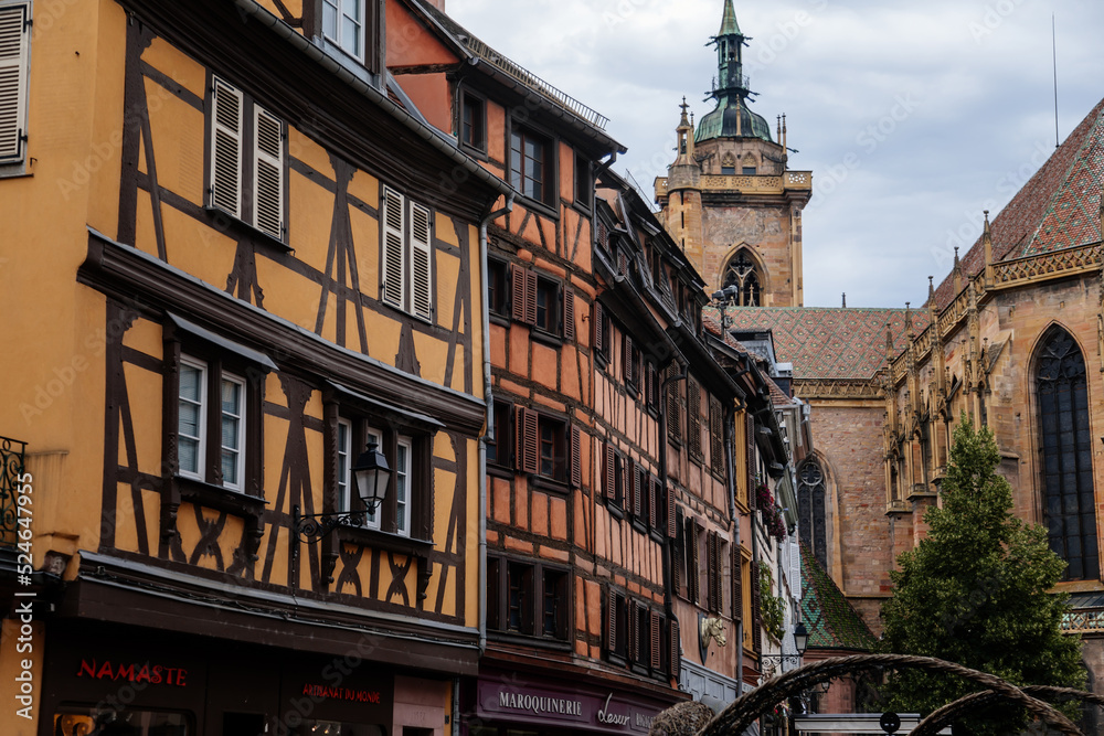 Colmar, Alsace, France, 4 July 2022: town capital of Alsatian wine, narrow picturesque street with medieval colorful houses, Timber framing or post-and-beam construction, Colmar, Alsace, France, 4 July 2022: town capital of Alsatian wine, narrow picturesque street with medieval colorful houses, Timber framing or post-and-beam construction,