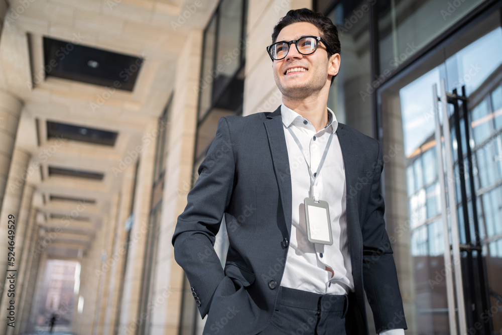 A businessman with glasses, a man goes to work in a new office in formal clothes.