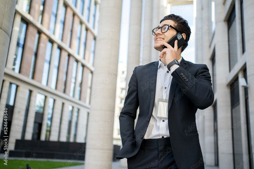 The manager is a man talking on the phone, going to work in a new office The manager is a man talking on the phone, going to work in a new office