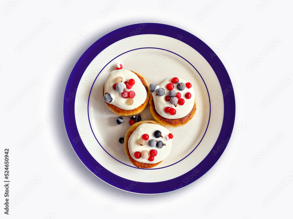 Delicious cheesecakes with wild berries on a plate on white background, isolated cheese pancakes Delicious cheesecakes with wild berries on a plate on white background, isolated cheese pancakes