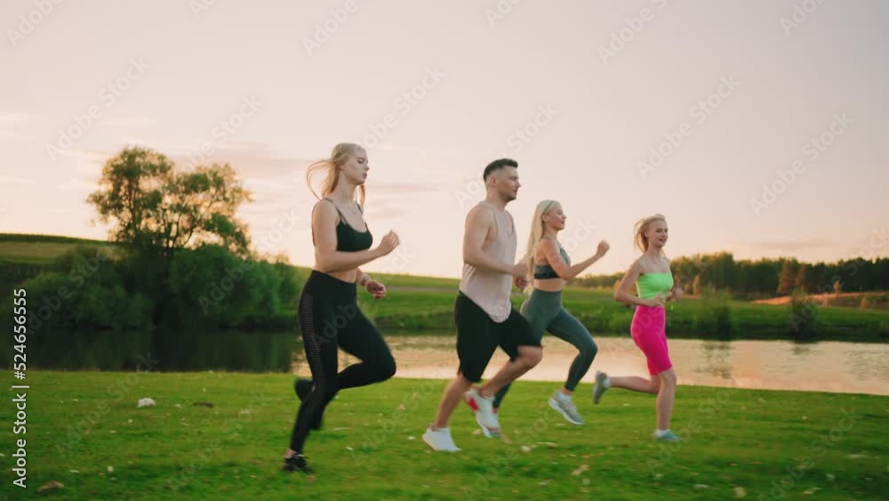 four active people are running together in summer morning, man and women in sportswear are jogging four active people are running together in summer morning, man and women in sportswear are jogging