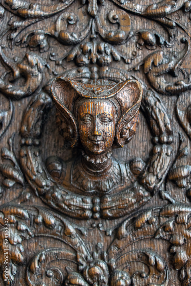 Carved decoration on the wall of a cabinet from the 16th century