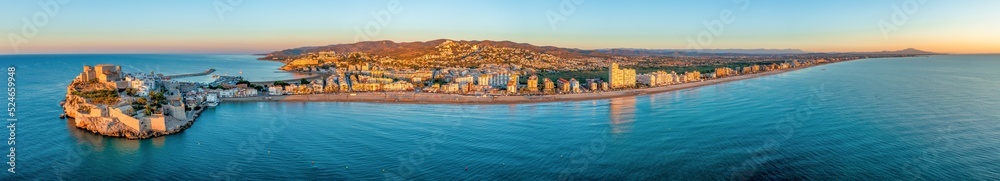 Wide panoramic view of Peniscola during sunrise, a coastal town in eastern Spain, Costa del Azahar, Province Castello, Spain