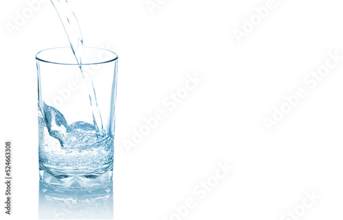 Mineral water pouring into glass isolated on white background. Ideal as advertising environmental, banner,brochure etc., 