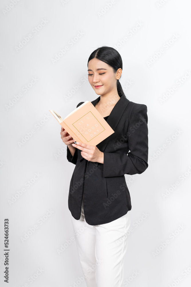 Portrait photo of a young beautiful and elegant asian woman holding a note book with a good nice friendly smile and different poses and emotion Portrait photo of a young beautiful and elegant asian woman holding a note book with a good nice friendly smile and different poses and emotion