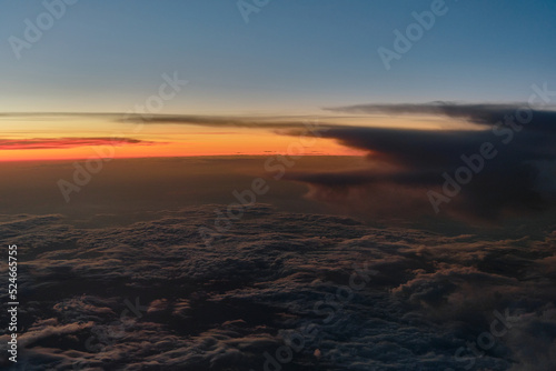 clouds photographed from the window curtain of an airplane © madnessbrains