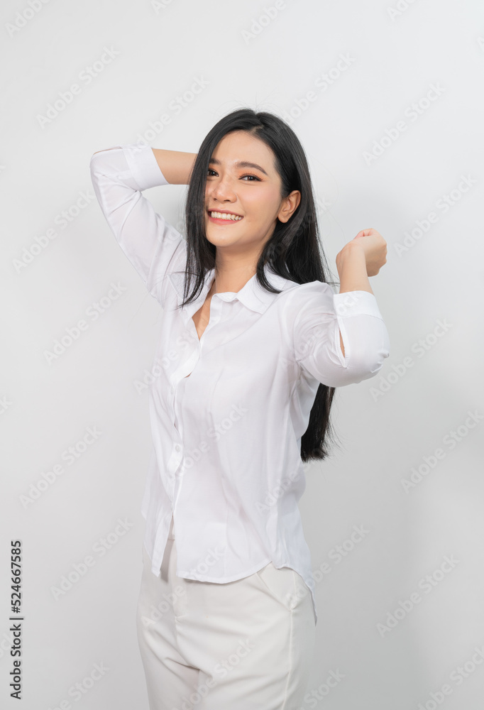 Portrait photo of a young beautiful asian female lady wearing a white shirt with a relaxing cheers pose Portrait photo of a young beautiful asian female lady wearing a white shirt with a relaxing cheers pose