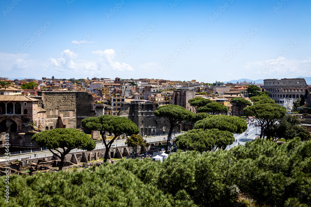 Panoramic view of Rome and the Colosseum. ancient architectural beauty mixed with more modern buildings.