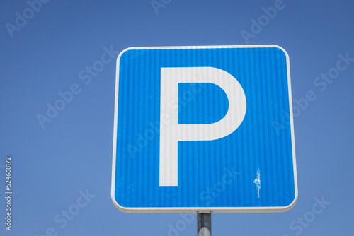 Huge parking sign with pigeon feces. Concept of lack of maintenance or cleaning.