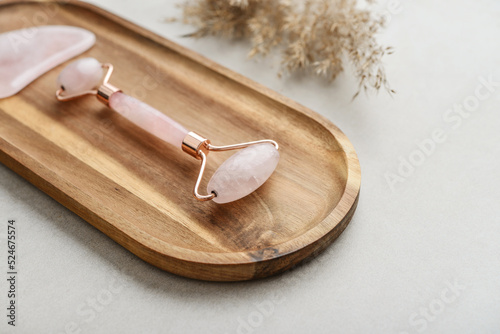 Facial rose quartz stone massage roller and gua sha massager