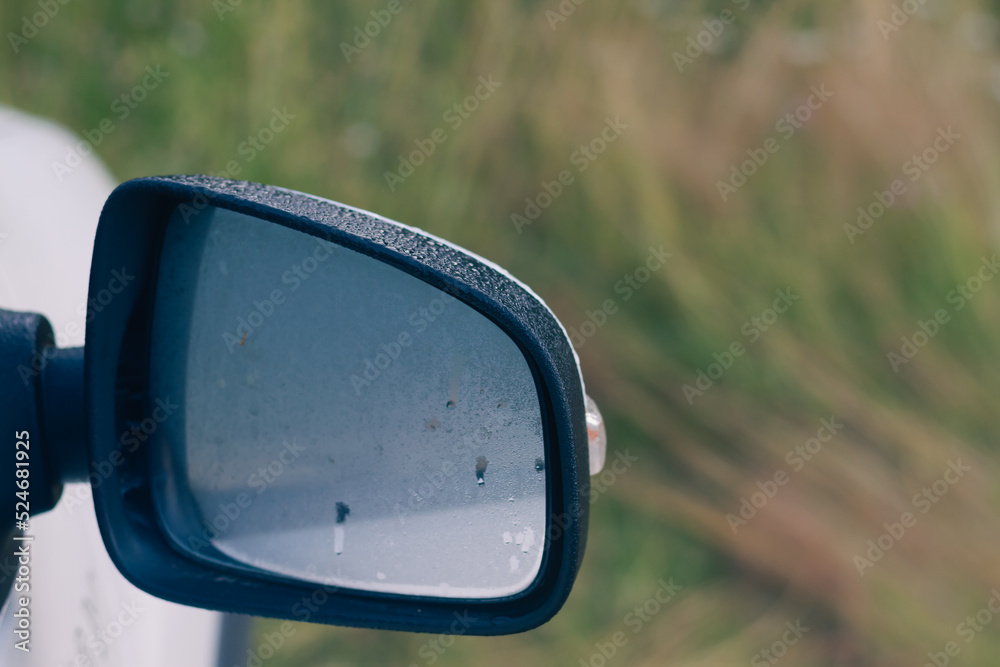 Fog condensation on the side mirror of the car early in the morning Fog condensation on the side mirror of the car early in the morning
