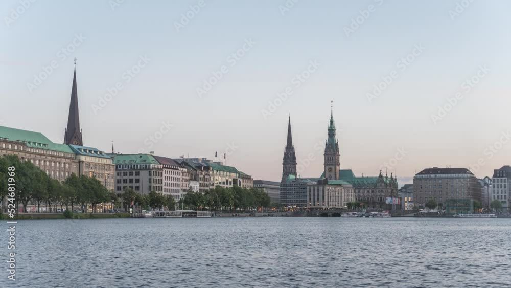 Hamburg Germany time lapse 4K, city skyline day to night timelapse at Alster Lake with Fountain Hamburg Germany time lapse 4K, city skyline day to night timelapse at Alster Lake with Fountain