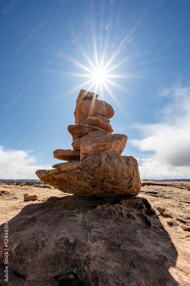Sunburst Over Cairn In Desert