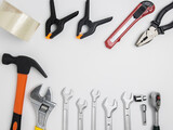 Top view of construction tools and tools highlighted on a white background with a space in the center