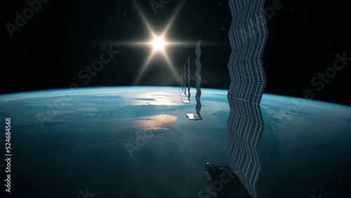 Silhouette view of a fleet of Internet starlink satellites in orbit above earth. A line of satellites providing internet connection from space with the sun in the horizon photo