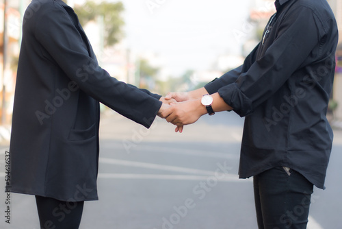 couple shaking hands in of outdoor