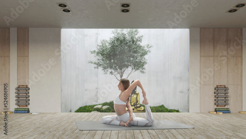 Young athletic attractive woman practicing yoga in a wooden yoga hall.