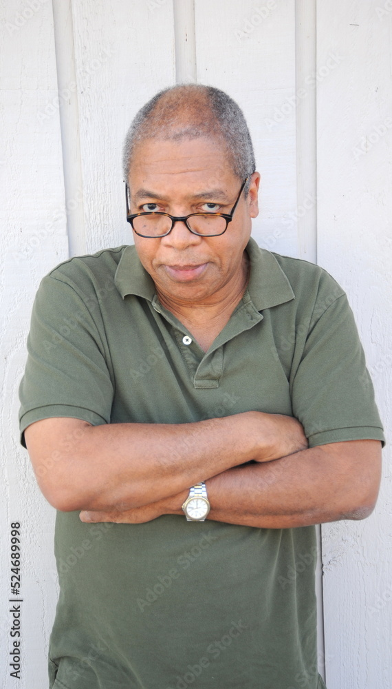 African american male against a wall outside. African american male against a wall outside.